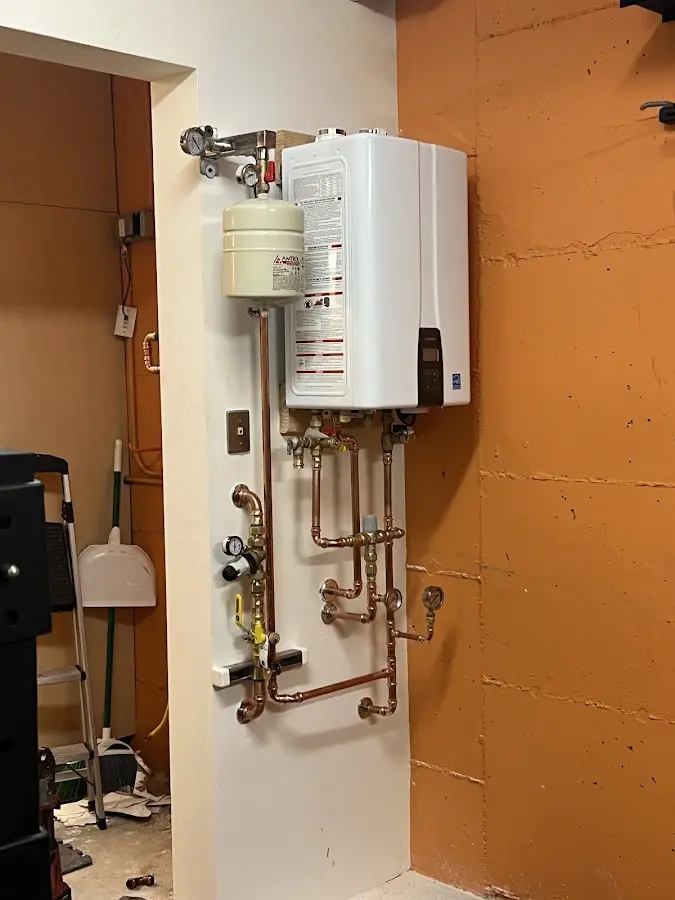 Plumbing technician inspecting water heater connections in Marina del Rey